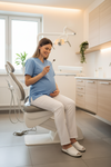 Woman sitting on a dental chair in a modern dental office