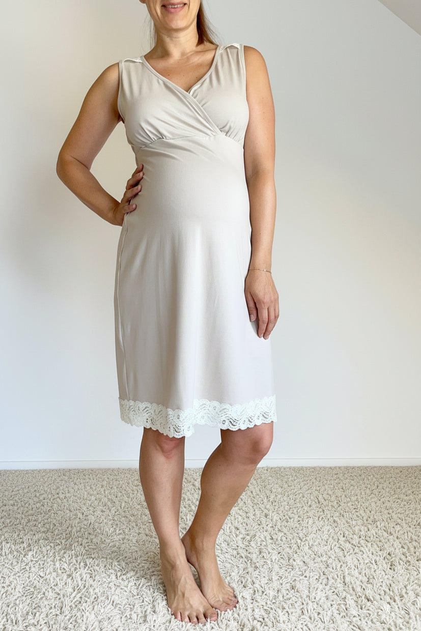 Woman wearing a beige dress with a white background